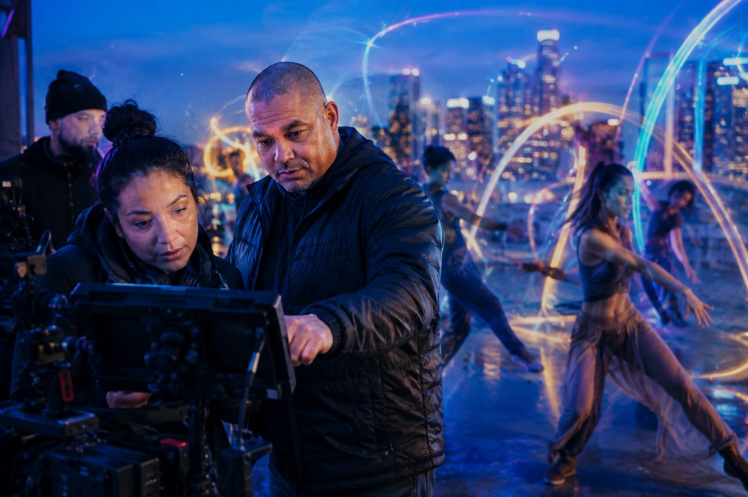 Devin Lockett at the monitor directing a rooftop shoot over the Los Angeles skyline